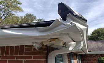 Damaged gutters being removed for replacement