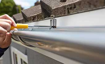 Professional conducting roof gutter inspection services