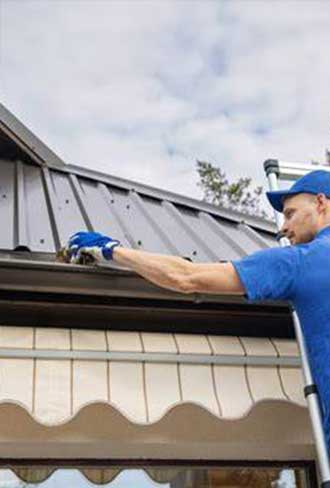 Professional conducting roof gutter inspection services