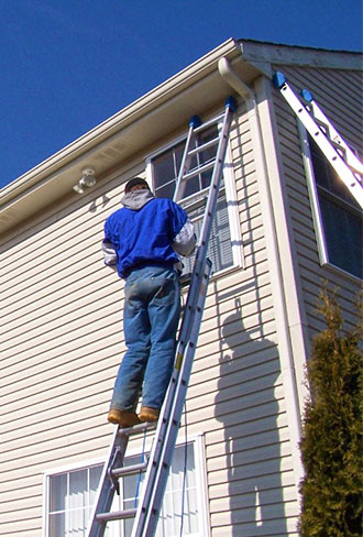 before and after comparison of home siding restoration